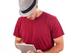 Man With Hat and Mobile Device