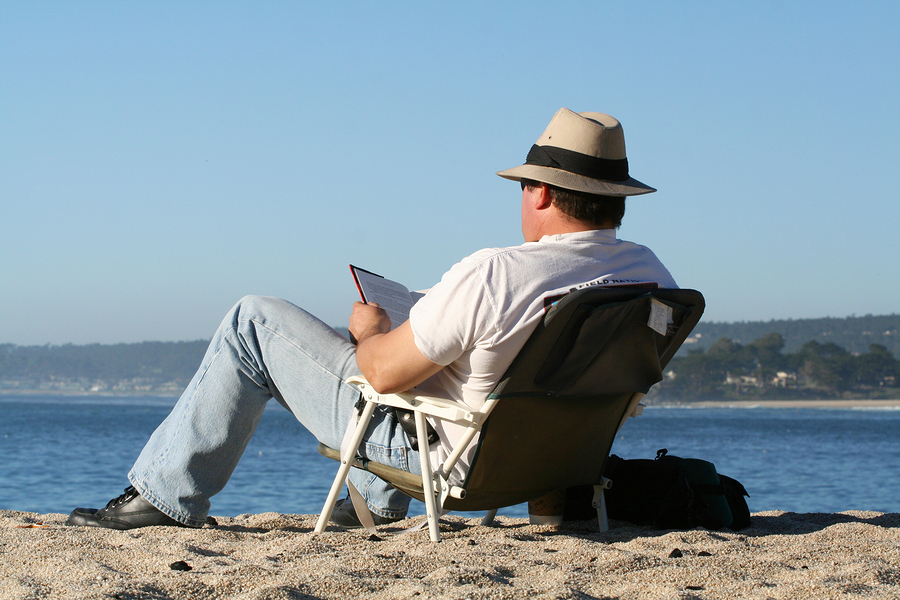 A photo of a man reading at the beach - TecEd: User Experience Research ...