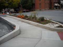 ADA curbed sidewalk with open ramps for street access