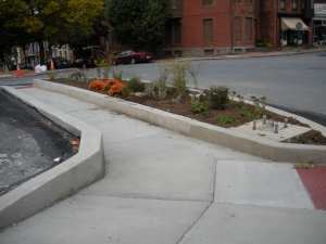 ADA curbed sidewalk with open ramps for street access 